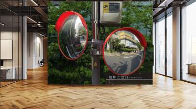 Dongsung-dong, Jongno-gu, Seoul, South Korea - April 30, 2023: Close up and spring view of two convex mirror with road reflection on telephone pole
 Wall mural