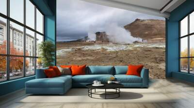 High angle and summer view of tourists on dirt ground besides vapor of geothermal spa at Hverir, Iceland
 Wall mural