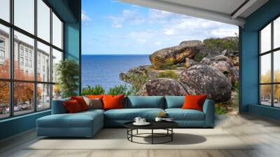 High angle view of trees and round red stones on the cliff against sea horizon at Watsons Bay of Sydney, New South Wales, Australia
 Wall mural