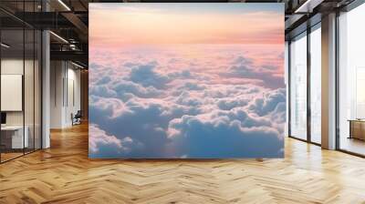 Beautiful pastel cloudscape. Fluffy clouds in the sky. Horizon from a plane. Weather and overcast dawn Wall mural