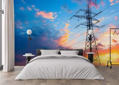 High voltage electric transmission tower. High voltage power lines on electric pylon against a sunset sky.  Wall mural