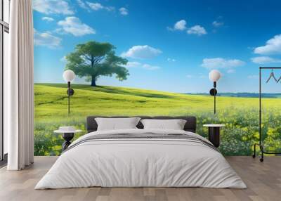 Panoramic Landscape with Solitary Oak Trees in Spring Fields of Grass and Rapeseed under Blue Sky Wall mural