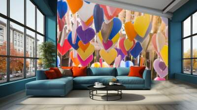 Colorful of hearts made of candle pattern designs hanging from c Wall mural