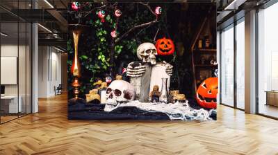 Scary evil skull. Outdoor halloween decoration. Halloween skeleton for decoration party. Artificial Ghost or scary for party.Trick or treat. Halloween background. Holiday of Halloween and Thanksgiving Wall mural