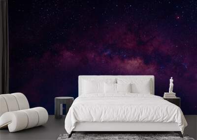 Milky way in the night sky and stars on dark background with noise and grain. Photo taken with long exposure and white balance selected. Wall mural