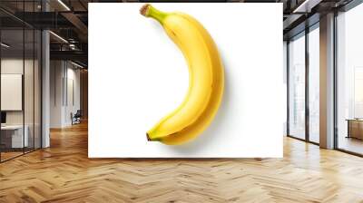 A single banana isolated on a white background, casting a soft shadow, ideal for a minimalist and clean visual representation of the fruit Wall mural