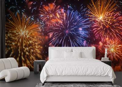 Colorful fireworks of various colors over night sky background Wall mural