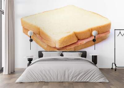 sliced white bread with ham sandwich on white background Wall mural