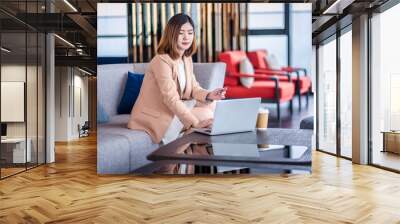 Team work process. Two women with laptop in open space office. Business concept., two women is meeting for business matching. ,Two young beautiful asian business woman in the conversation. Wall mural