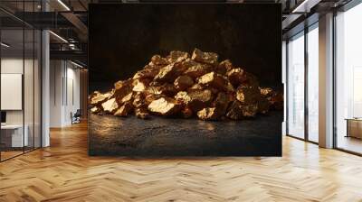 A stunning close-up of a golden pile showcasing the rich texture and shine of precious metal against a dark background. Wall mural