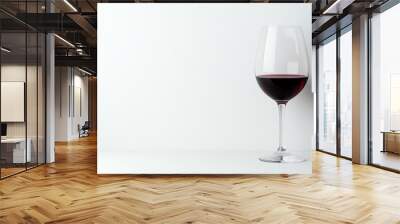 Red wine glass on white isolated background Wall mural