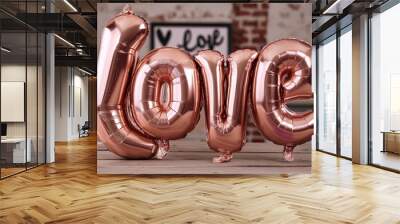 A rose gold color balloon in the shape of the letter 