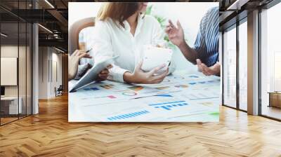 A group of business people working together on a new project to analyze budgets and manage investment risks in today's profit boosting for marketing in the conference room Wall mural