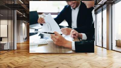 Teamwork concept, consultation, male economist using documents budget, finance and investment documents, discussing and planning finances with female advisors in conference room Wall mural