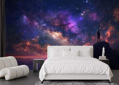 A lone figure gazes at a vibrant cosmic sky filled with stars, colors, and swirling galaxies, evoking wonder and exploration. Wall mural