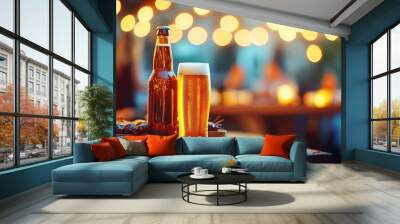 Beer bottle and glass on a wooden table, blurred lights in the background. Wall mural