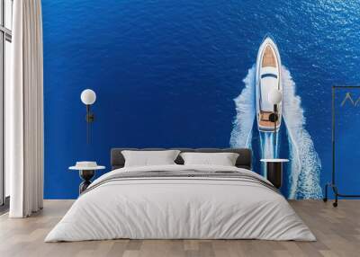 Luxury yacht cruising through clear blue waters, aerial view. Wall mural