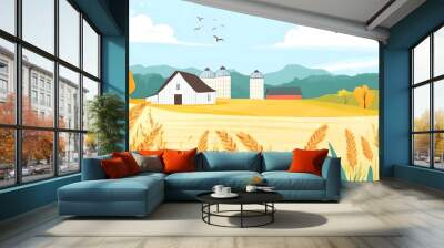 A scenic farm landscape featuring golden wheat fields, a white barn, and rolling hills under a bright blue sky. Wall mural