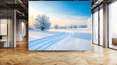 A serene winter landscape featuring snow-covered trees and a clear blue sky, creating a tranquil and picturesque scene. Wall mural