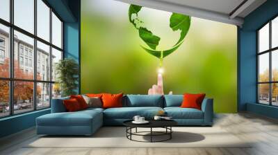 human hand pointing world map in green leaf environmental concept on earth day Wall mural