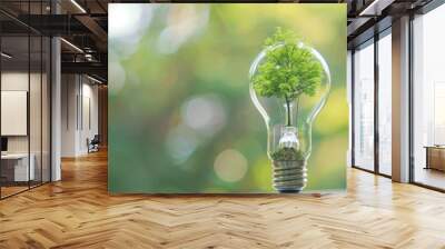 Illuminating Sustainability: Light Bulb with Tree Inside Symbolizing Green Energy and Environmental Protection Wall mural