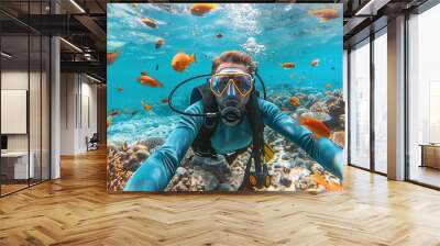 Scuba diver swimming underwater, pristine white sand under tropical sea clear blue, Colorful coral reef, snorkeling amongst many clownfish Wall mural