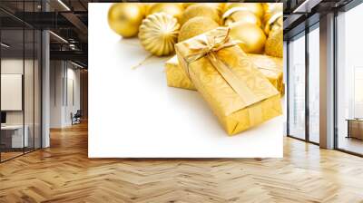 Gift wrapped in gold foil and christmas balls. Christmas decaration isolated on white background. Wall mural