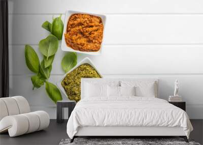 Green basil and red tomato pesto dip sauce  and basil leaves. Wall mural