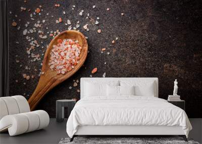 Pink himalayan salt in wooden spoon. Top view. Wall mural