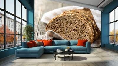 Sliced whole grain bread with oat flakes. Wholemeal bread. Wall mural