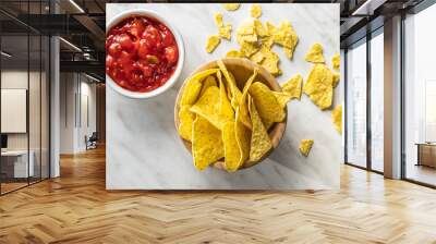 Tortilla chips and red tomato salsa dip. Mexican nacho chips. Wall mural