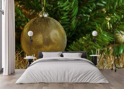 horizontal image of the detail of golden decoration on the christmas tree with gold chain. gold and  Wall mural