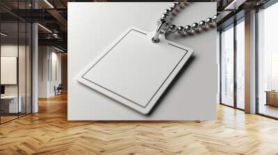 A mockup of a blank white square clothing label attached to a metal ball chain, designed as an empty price tag template for design purposes.  Wall mural