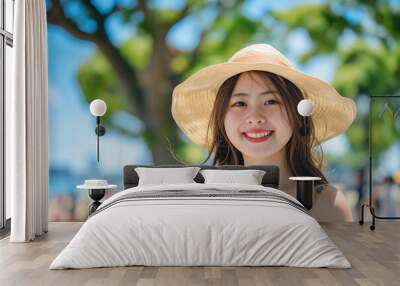 Traveling , lifestyle, Relax,summer ,Asian woman wearing a Summer attire smiling and posing in front of a seaside Park in Yokohama  Wall mural