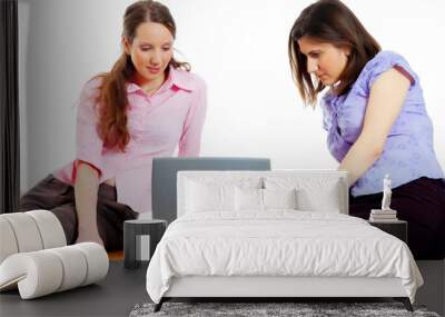 two young attractive women working with the computer Wall mural