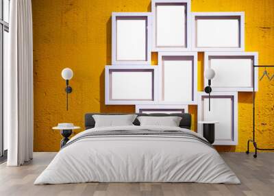 Photo frame on wall. A blank white picture frame hanging on an old yellow plaster wall Wall mural