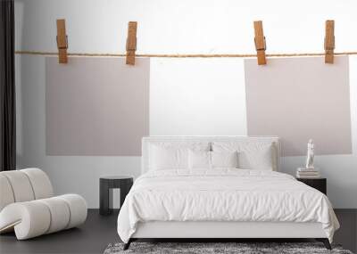 Two frames that hang on a rope with clothespins and isolated on white. Blank cards on rope mockup template Wall mural