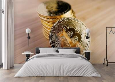 Gold bitcoin on the table. Wall mural