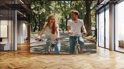  happy couple riding bicycle in park Wall mural