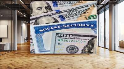 Closeup of social security benefits identification card with 100 dollar bills Wall mural