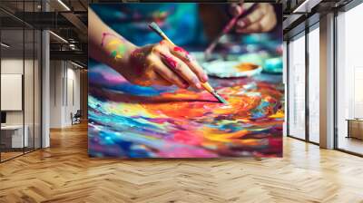 Close up of a creative artist's hands painting vibrant strokes on a canvas in artistic process in workshop Wall mural