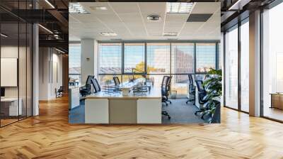 Empty places for workers in contemporary coworking. Startup business office interior at new workplace. Open space office interior Wall mural