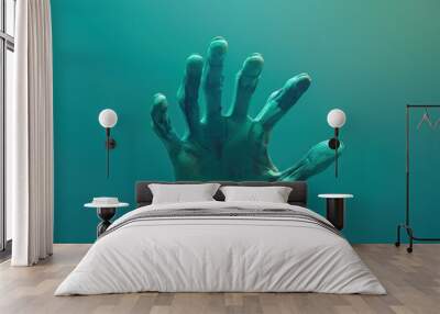 a creepy raised hand with 6 fingers against blue turquoise background Wall mural