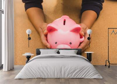 kid holding his piggy bank Wall mural