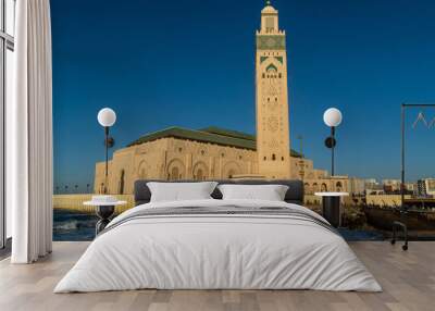 view of Hassan II Mosque against blue sky - The Hassan II Mosque or Grande Mosquée Hassan II is a mosque in Casablanca, Morocco. Wall mural