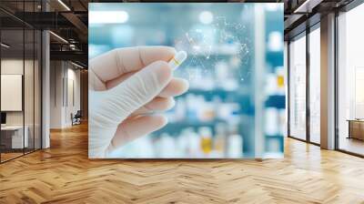 A hand in a glove holds a capsule with digital health icons in the background. Wall mural