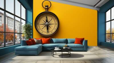 A single compass on a solid color backdrop with copy space Wall mural