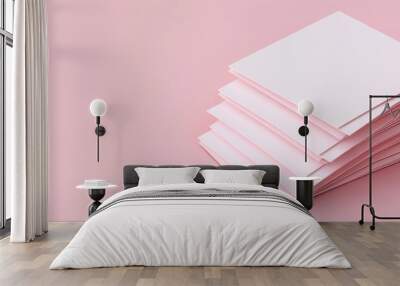 A stack of blank, pastel pink sheets on a soft pink background, ideal for creative projects, stationery, or minimalistic design. Wall mural