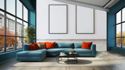 An airy and spacious living room with a minimalist design and blank posters on a wall, banner, with copy space Wall mural