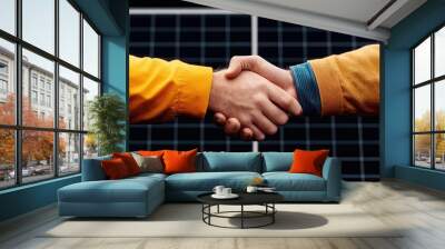 Close-up of two hands shaking, symbolizing agreement and partnership, with a solar panel background. Wall mural